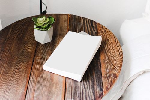 Canva - White Book on Brown Round Table_ Canva - White Book on Brown Round Table_